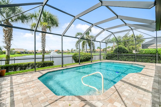 view of pool featuring a lanai, a water view, and a patio