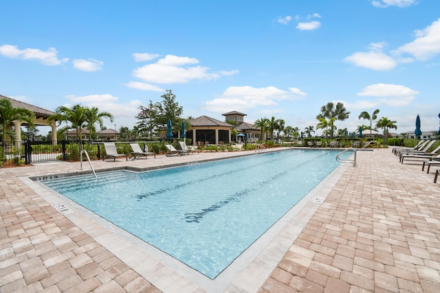 view of swimming pool featuring a gazebo and a patio area