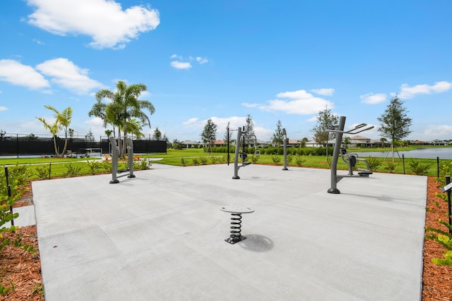 view of property's community featuring a water view and a yard