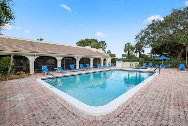 view of swimming pool with a patio