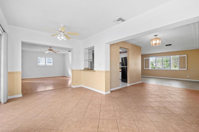 spare room with a textured ceiling, light wood-type flooring, and ceiling fan