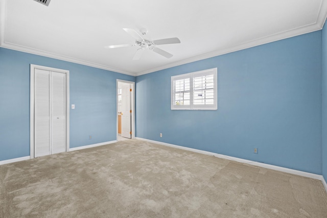 spare room with ceiling fan, light carpet, and a textured ceiling