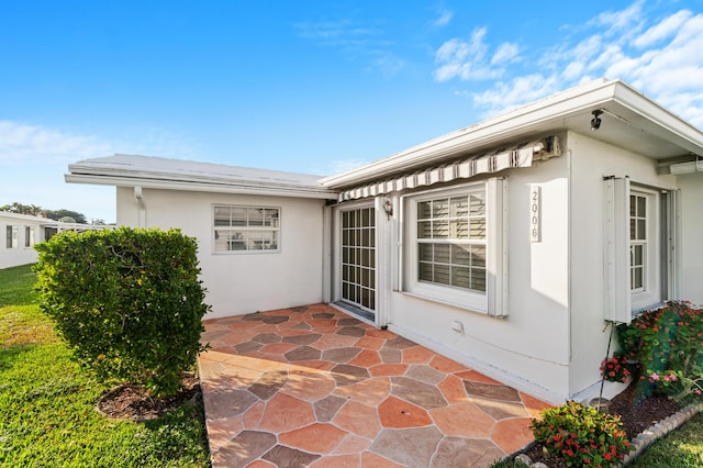 rear view of property with a lawn