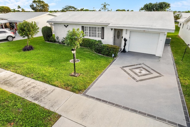 ranch-style house with central AC, a front lawn, and a garage