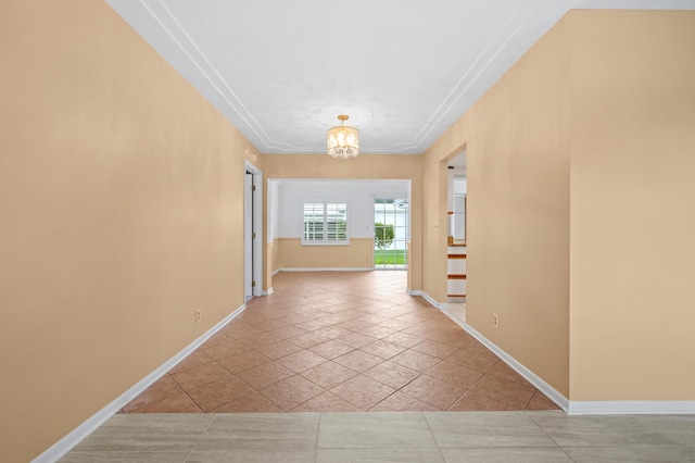 unfurnished living room with ceiling fan with notable chandelier, a textured ceiling, and light wood-type flooring