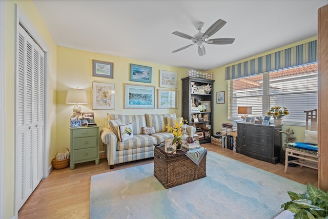 sitting room featuring ceiling fan and light hardwood / wood-style floors