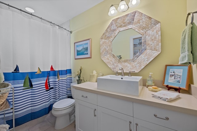 bathroom featuring toilet, tile patterned floors, and vanity