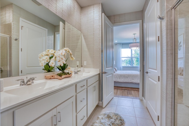 bathroom with vanity, tile patterned floors, and a shower with shower door