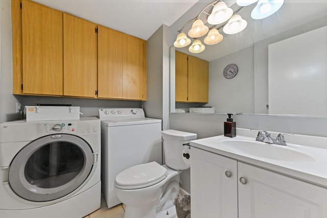 laundry room featuring washing machine and clothes dryer and sink