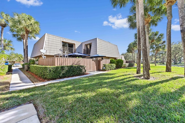 view of property exterior featuring a lawn