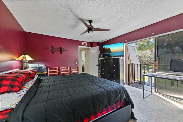 bedroom with carpet flooring, access to exterior, ceiling fan, and a textured ceiling