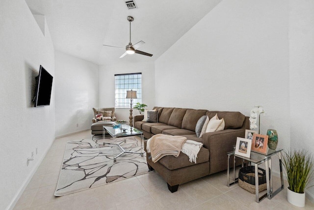 tiled living room with ceiling fan and lofted ceiling