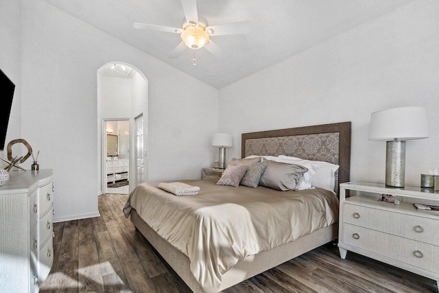 bedroom featuring ceiling fan, lofted ceiling, dark hardwood / wood-style flooring, and ensuite bath