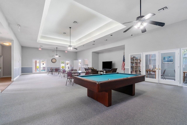 playroom with a tray ceiling, billiards, french doors, and ceiling fan