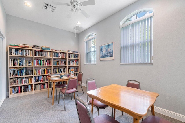 office with carpet floors and ceiling fan