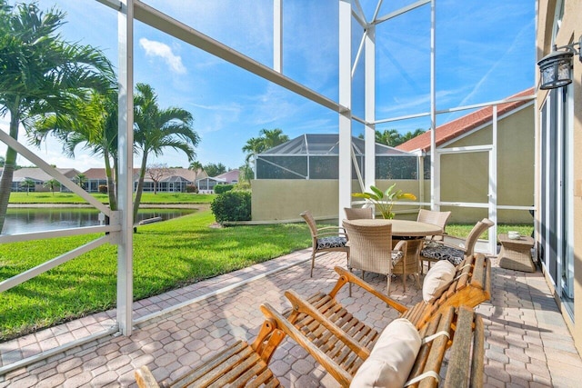 unfurnished sunroom featuring a water view