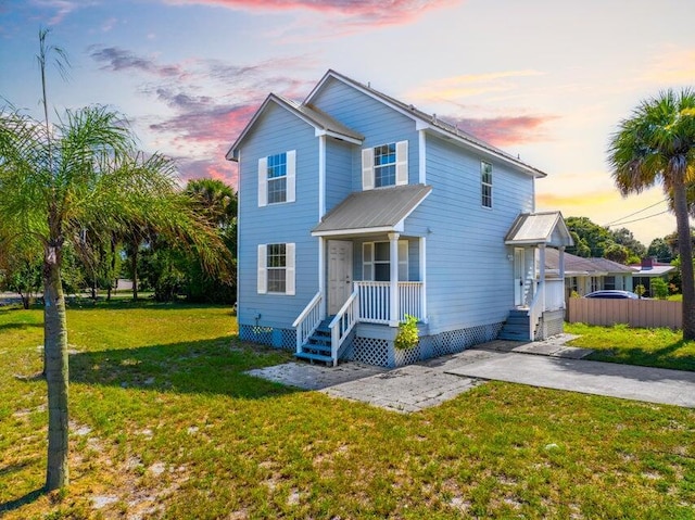 view of front of house with a lawn