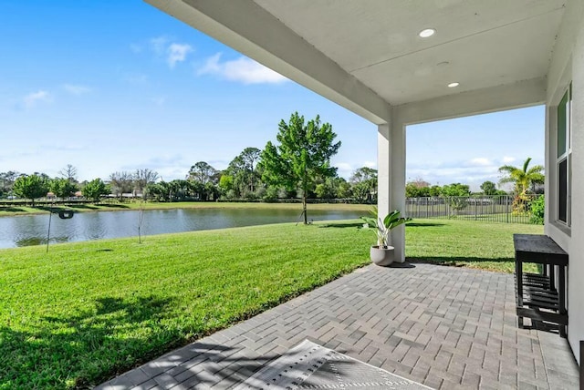 view of patio featuring a water view