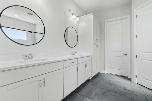 bathroom featuring vanity and walk in shower