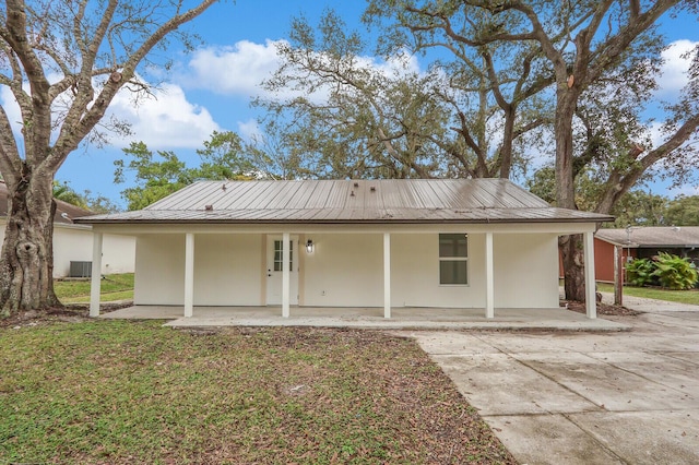 rear view of property featuring a porch