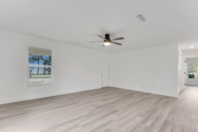 unfurnished room with ceiling fan and light hardwood / wood-style flooring