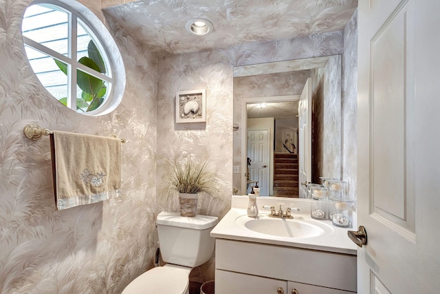 bathroom with vanity and toilet