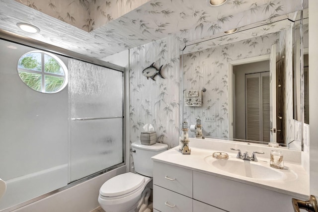 full bathroom with vanity, toilet, and enclosed tub / shower combo