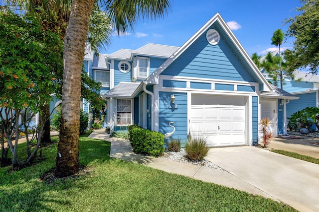 view of front facade with a garage and a front yard