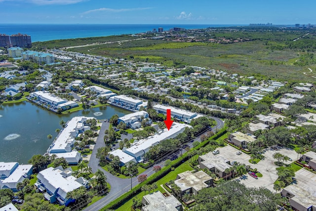 birds eye view of property featuring a water view