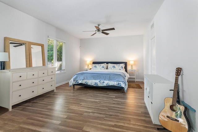 bedroom featuring ceiling fan and dark hardwood / wood-style flooring