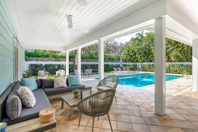 view of swimming pool featuring an outdoor living space, ceiling fan, and a patio