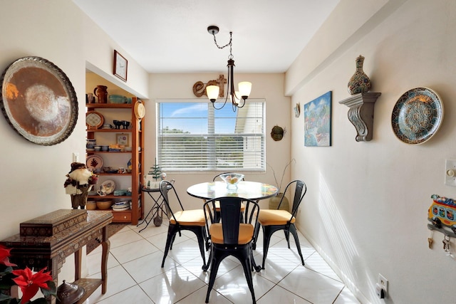 tiled dining area featuring an inviting chandelier