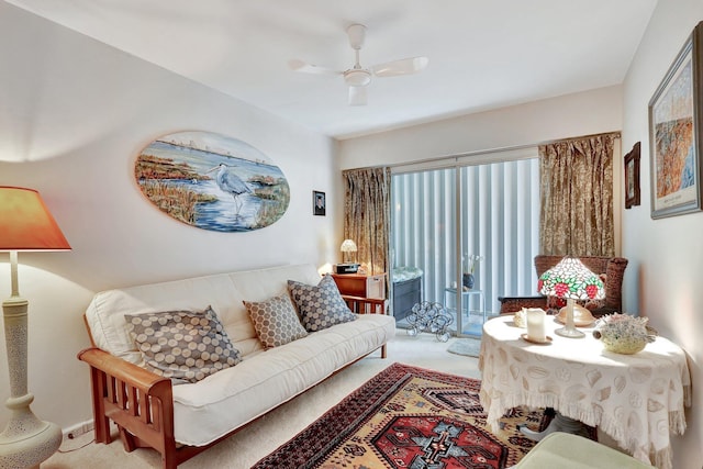 carpeted living room featuring ceiling fan