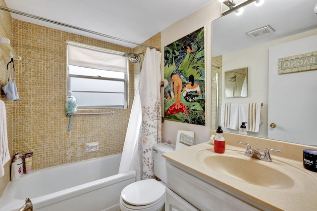 full bathroom with vanity, toilet, and shower / tub combo with curtain