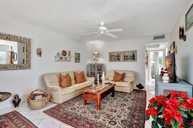 tiled living room with ceiling fan