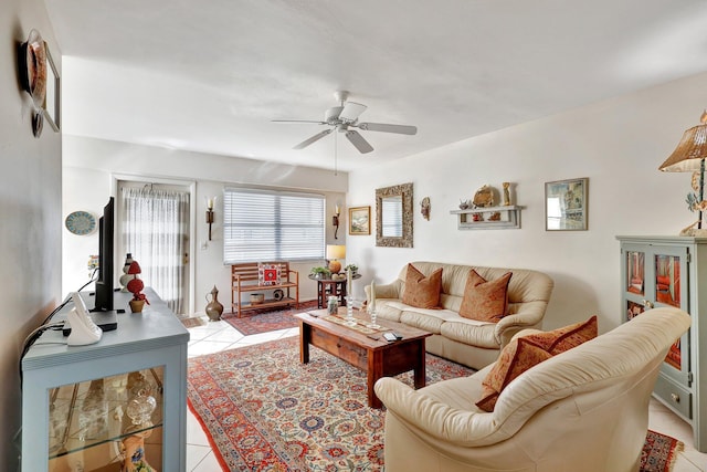 living room with ceiling fan and light tile patterned floors