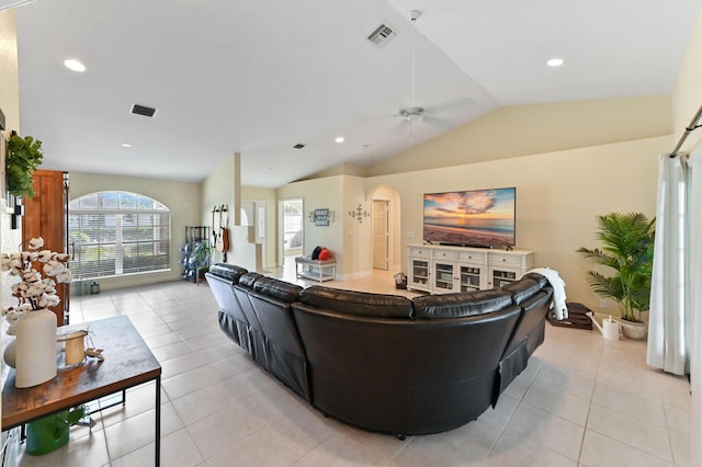 tiled living room featuring vaulted ceiling and ceiling fan