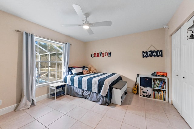 tiled bedroom featuring a closet and ceiling fan