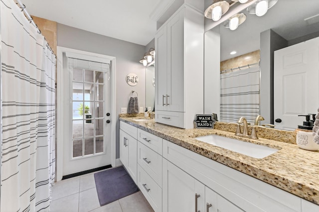 bathroom with tile patterned floors and vanity