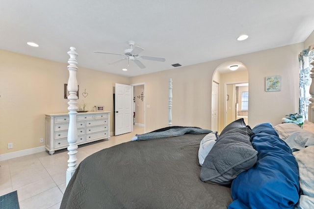 tiled bedroom with ceiling fan