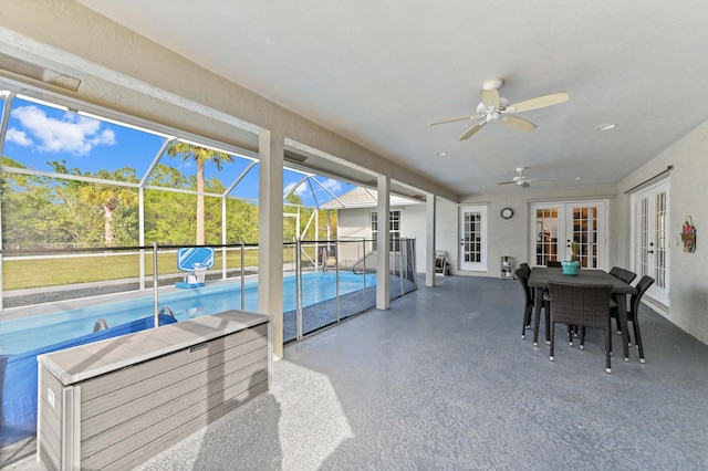 exterior space with french doors, a patio, glass enclosure, and ceiling fan