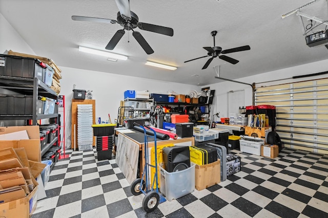 garage with a garage door opener and ceiling fan