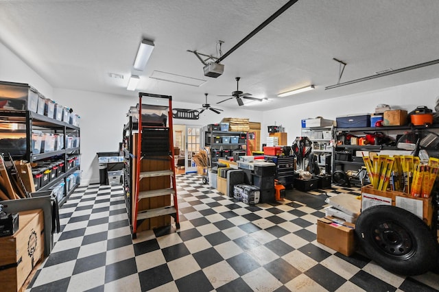 garage featuring a garage door opener and ceiling fan