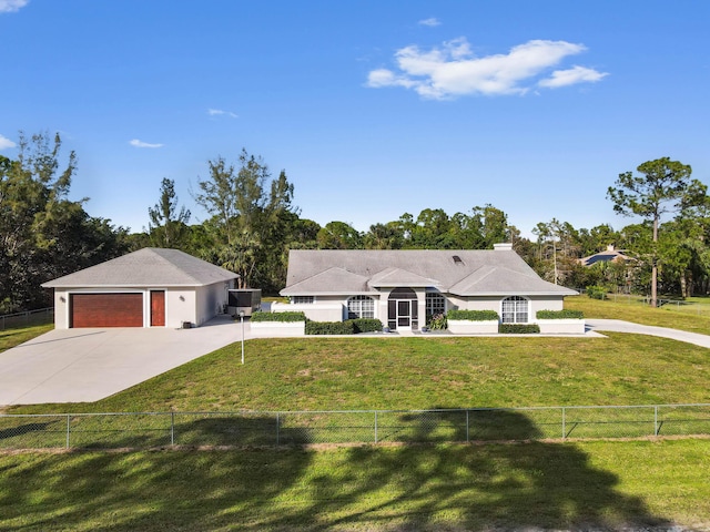 ranch-style house featuring a garage and a front yard