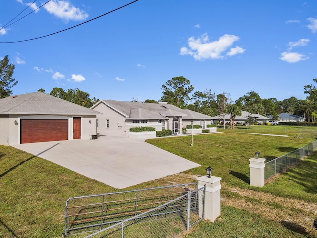 view of front facade featuring a front lawn and a garage