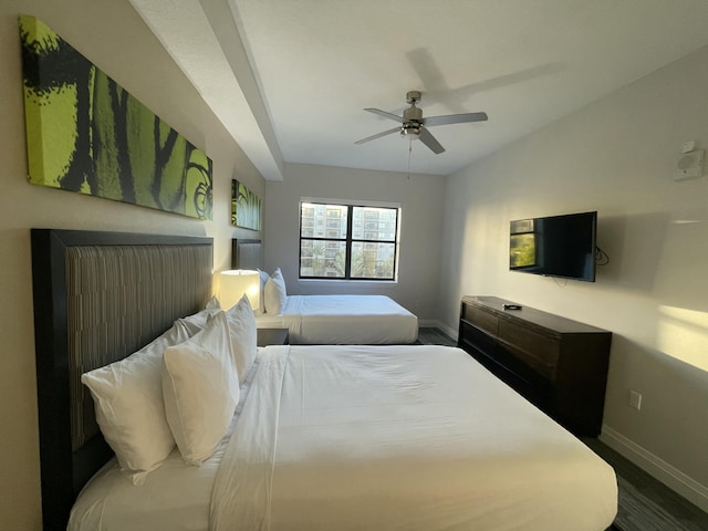 bedroom with wood-type flooring and ceiling fan