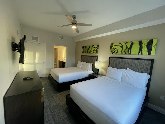 bedroom featuring ensuite bathroom and ceiling fan