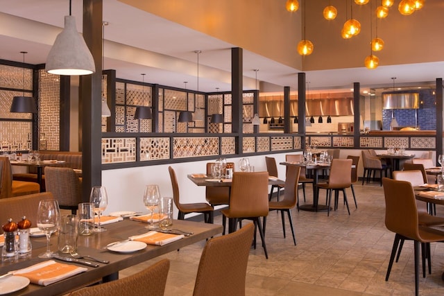 dining space with a towering ceiling