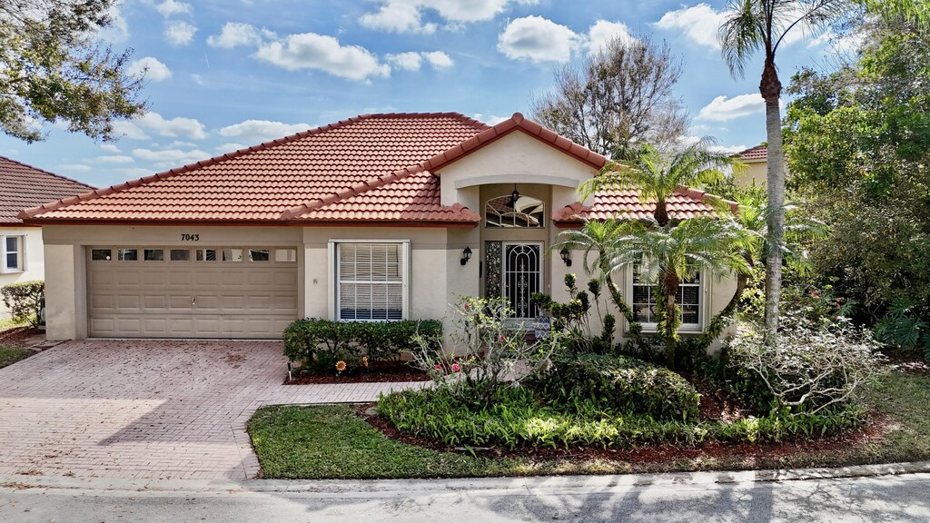 mediterranean / spanish house featuring a garage