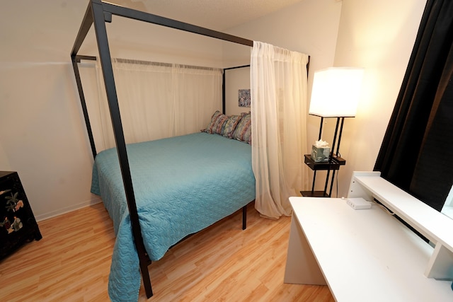 bedroom with light hardwood / wood-style flooring